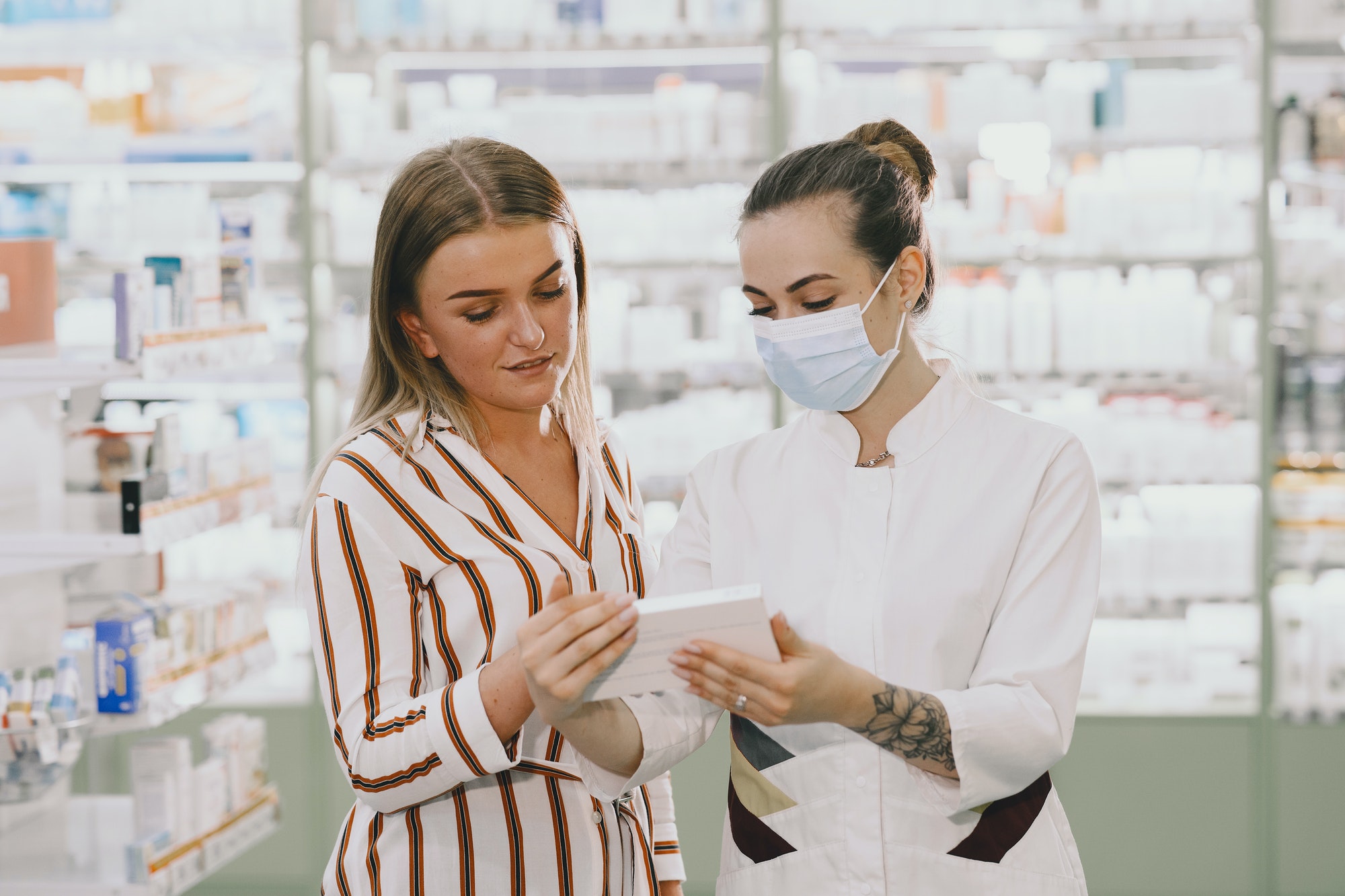 woman-pharmacist-checking-medicine-in-pharmacy.jpg